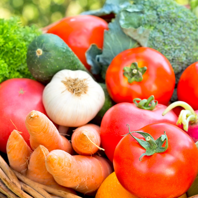 A small basket full of colourful vegetables