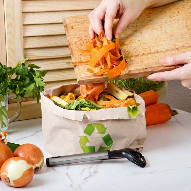Putting veg peelings in a zero food waste bin