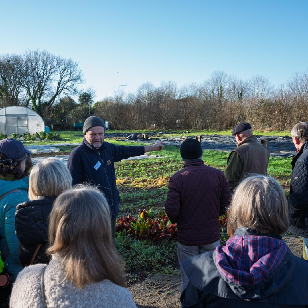 A group of people outdoors at GROW HQ with Richard.