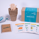 Growbox for kids gardening kit with pots, sticks, and educational cards on a white background